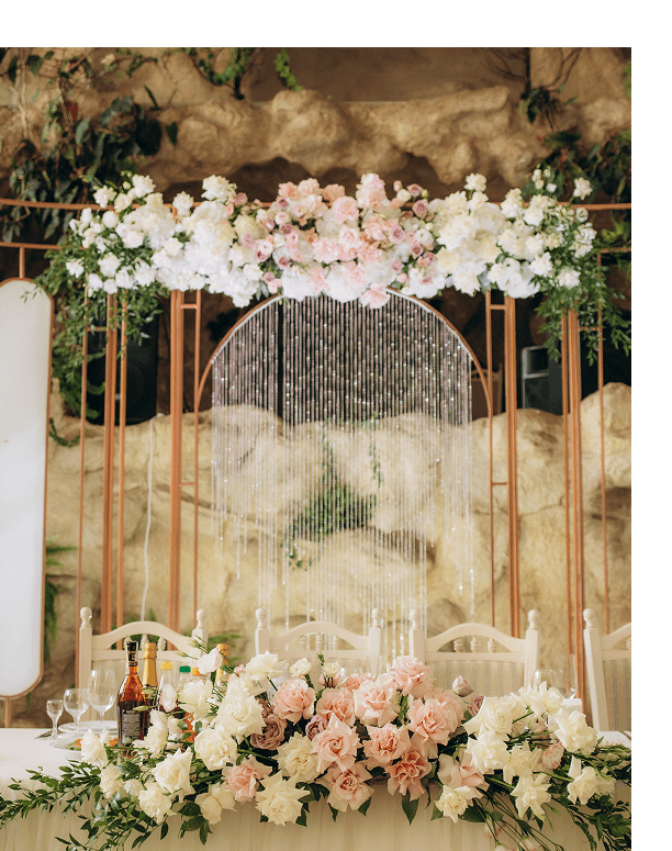 Wedding floral design with blush and ivory flowers